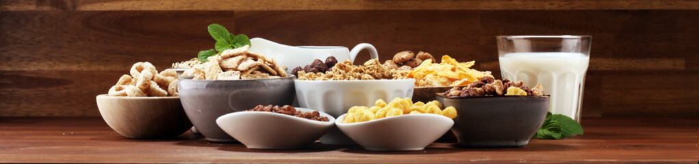 Cereal. Bowls of various cereals and milk for breakfast. Muesli with kids cereals.