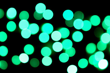 Unfocused abstract colourful bokeh black background. defocused and blurred many round blue light