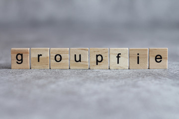 Groupfie word written on wood cube