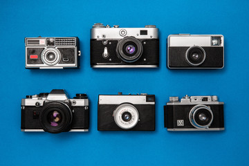 vintage camera collection on blue