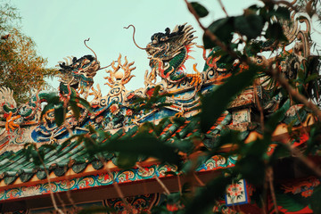 The dragon on the chainese temple roof in the morning.