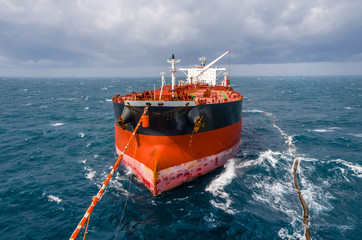 Oil tanker is transferring supply to the oil vessel.
