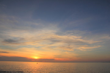 Naklejka na ściany i meble Beautiful sunset on the beach,Sea on the twilight sky,for background.