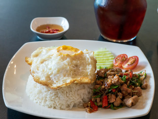 Rice with fired egg and pork basil food in Thailand