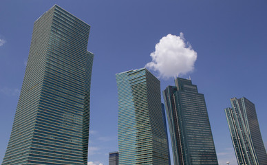Fototapeta premium Beautiful tall buildings against the blue sky