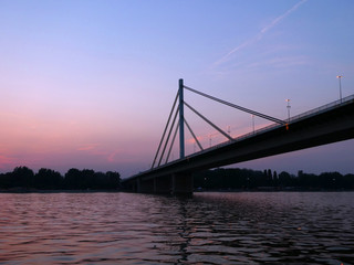 Fototapeta na wymiar Novi Sad, Serbia - June 15th, 2019: Bridge over Danube in Novi Sad at sunset