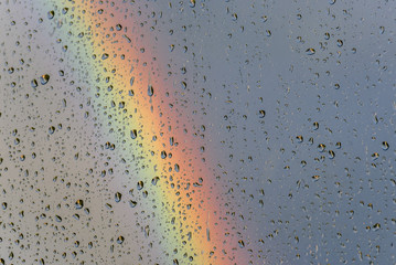 rainbow rain drops glass sky