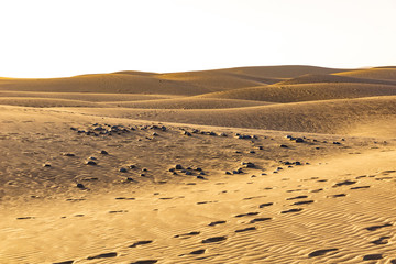 Beautiful view of the sandy dunes. Footprints in the sand. Gran Canaria, Canary Islands.