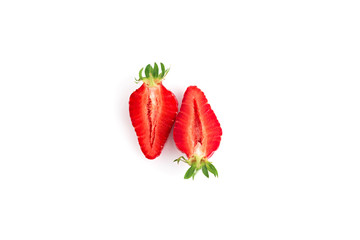 Red strawberries cutted close up on white background. Isolated on white.