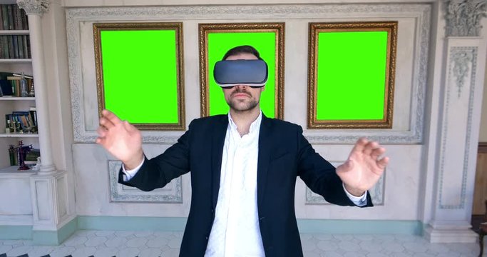 Portrait of modern man wearing VR headset during virtual tour