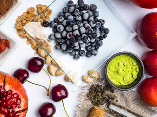 mix of fresh fruits and berries, rich with resveratrol raw food ingredients. nutrition background