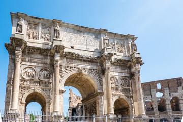 Fototapeta na wymiar ROME, Italy: The Arch of Constantine in Rome with Colosseum in background. Arco di Costantino.