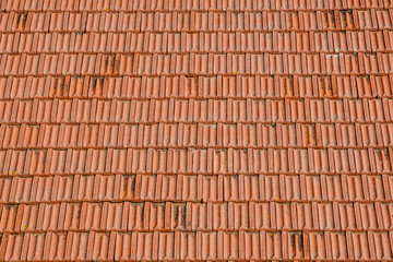 Red corrugated tile element of roof. Seamless pattern.