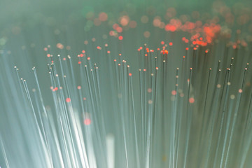 Abstract glowing optical fibres close up macro shot for background.