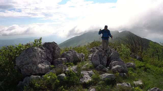 A man hiking on a rocky Mountain