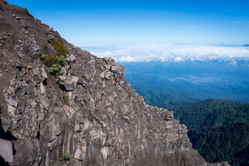 Fototapeta na wymiar An extreme track to Raung mount summit called 'Puncak Sejati'. Raung is the most challenging of all Java’s mountain trails, also is one of the most active volcanoes on the island of Java in Indonesia.