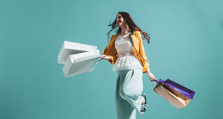 Cheerful young woman enjoying shopping