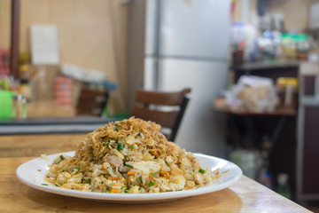Traditional food with rice on table in Vietnamese restaurant.