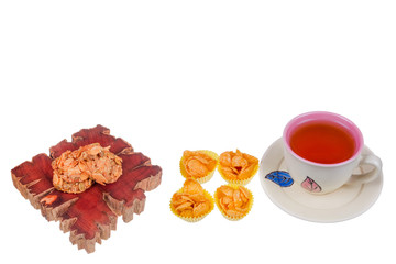 Tea cup , florentine cookies and honey corn flake cookies  on white background