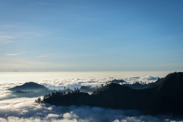 A stunning colorful mountain sunset or sunrise on campsite 7 mount Raung. Raung is the most...
