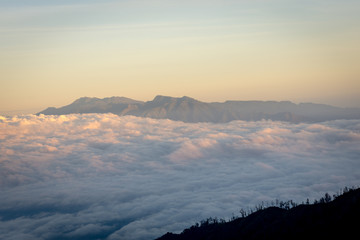 A stunning colorful mountain sunset or sunrise on campsite 7 mount Raung. Raung is the most challenging of all Java’s mountain trails, and the most active volcanoes on the island of Java Indonesia.