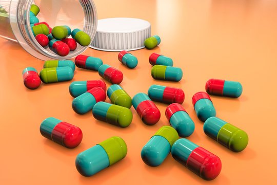 3d illustration: bright colored medical pills are scattered on a orange-brown table from a transparent medicine bottle. Pharmaceutical business and healthcare.