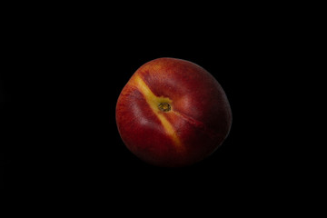 Peach isolated on black. Full depth of field.
