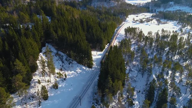 AERIAL. Train Oslo - Bergen in mountains. Hordaland, Norway. 