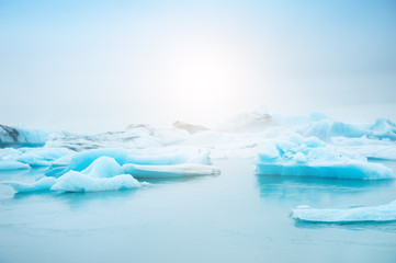 Fototapeta na wymiar Blue icebergs in Jokulsarlon glacial lagoon, southern Iceland. Famous travel destination