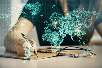 Social network theme hologram over hands taking notes background. Concept of global international...