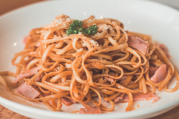 Aglio Olio Peperoncino Linguine & chicken strips tossed with olive oil, garlic and chilli flakes.  Topped with parmesan cheese and parsley.