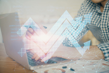 Growing arrows with businessman working on computer on background. Success concept. Double exposure.