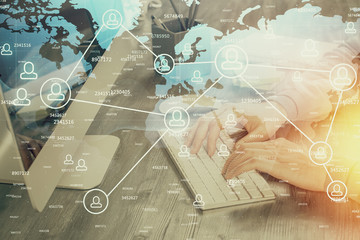 Social network theme hologram with businessman working on computer on background. Concept of world...
