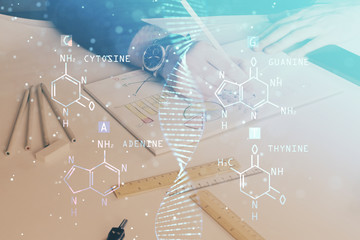 Man's hands working with notes background. Genetic engineering and gene manipulation concept.