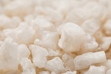 Fototapeta na wymiar close up view of white textured granulated sea salt