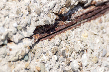 rust stains on concrete surface . Texture of old gray concrete wall for background.Reinforced concrete with damaged and rusty metallic reinforcement