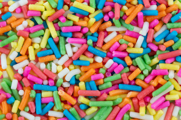 Sugar sprinkle dots background and texture, rainbow sugar  topping decoration for cake,bekery and ice cream.