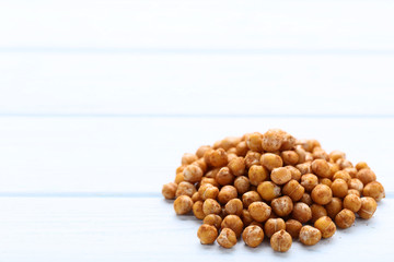 Roasted chickpeas on wooden table