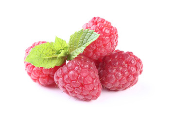 Ripe raspberries with green leafs isolated on white background
