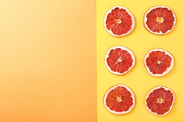 Dried grapefruits on colorful background