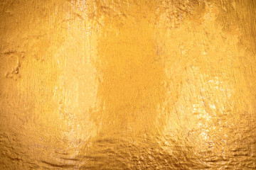 Gold texture with stone background. Detail of Golden surface made from rock.