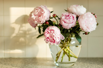 Pink peonies in the vase.
