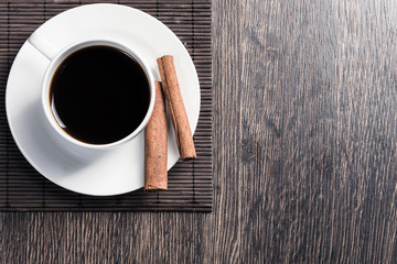 Cup of black coffee on wooden table