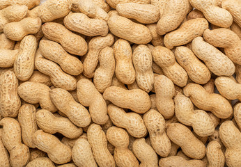 Peanuts in the shell. Texture for designers. Food. Background of peanuts.