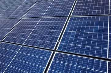 PV Solar panel roof, U.K. Industrial building clad in cells.