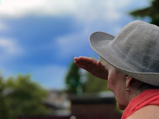 Fototapeta premium woman looking at the stormy sky