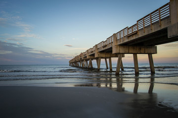 Fototapeta na wymiar Sunset over Atlantic ocean with pier