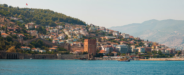 Panorama of the old town overlooking the beach. View of the resort town. Alanya is popular tourist...