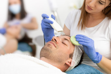 Obraz na płótnie Canvas treatment of cleaning facial male skin