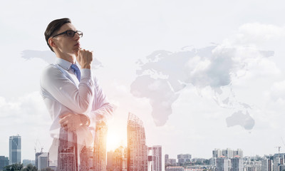 Concept of business success and control with confident boss against cityscape background